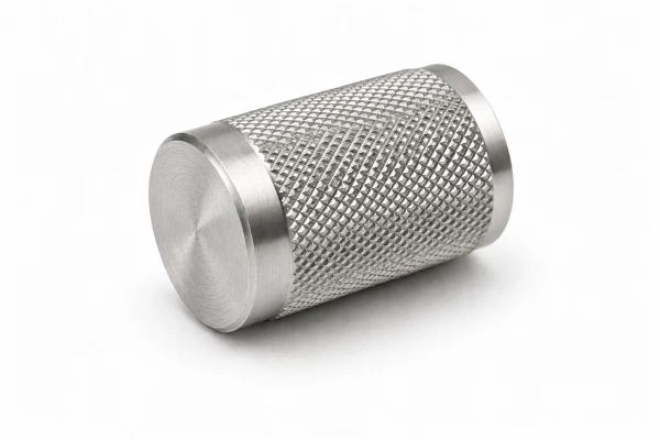 CNC machined stainless steel cylindrical knob with precision diamond knurling pattern, providing anti-slip grip and high machining accuracy on white background.